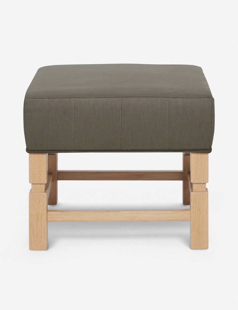 #color::loden | Ambleside Loden gray linen upholstered ottoman by Ginny Macdonald with a carved frame and vertical channeling on the cushion