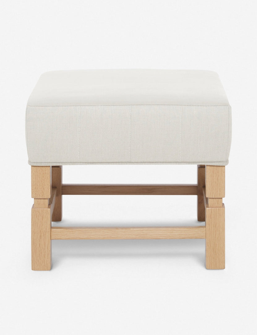 #color::natural | Ambleside Natural linen upholstered ottoman by Ginny Macdonald with a carved frame and vertical channeling on the cushion