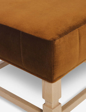 Close-up of the corner on the cushion of the Ambleside cognac velvet ottoman