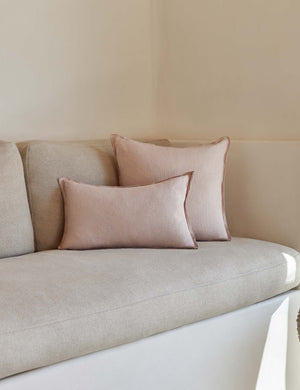 The arlo Greige flax linen pillow in its lumber and square sizes sit together on a natural linen sofa