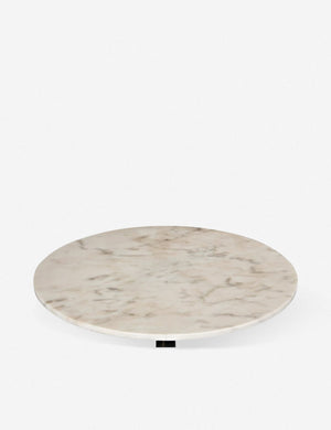 Singled-out view of the marble table top on the Auriel side table with cast iron base