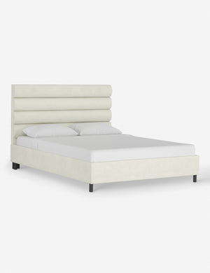 Angled view of the Bailee antique white platform bed