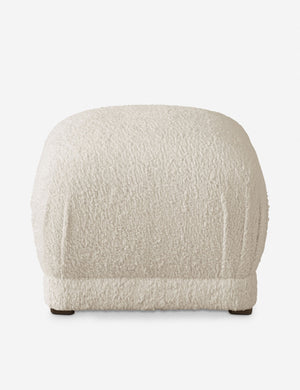 Bailee Cream Sherpa upholstered ottoman with a pouf-like design and pleated corners