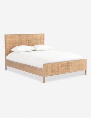 Side view of  Hannah bed with light wood cane bed frame.