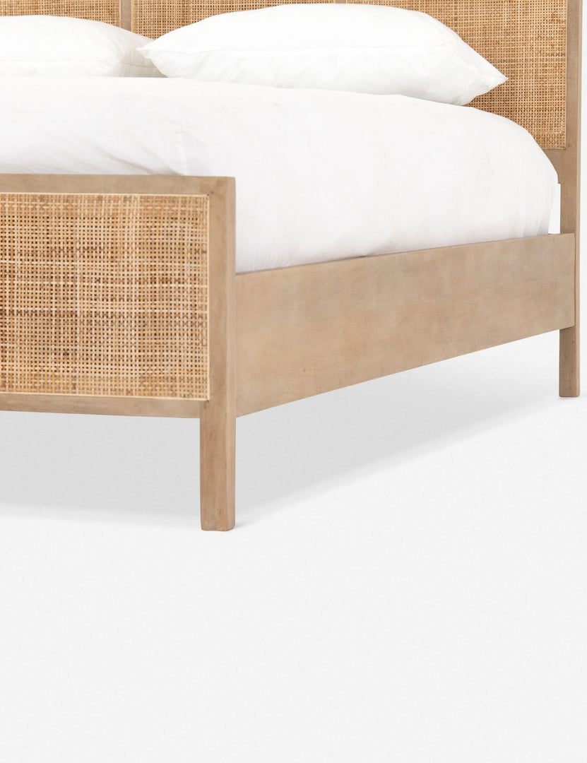 #size::king #size::queen #color::natural | Close-up view of the light wood base and cane detailing on the Hannah bed.  