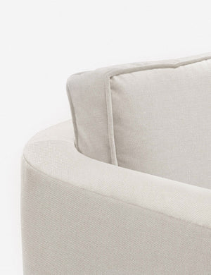 Close-up of the curved back on the Belmont Natural linen accent chair