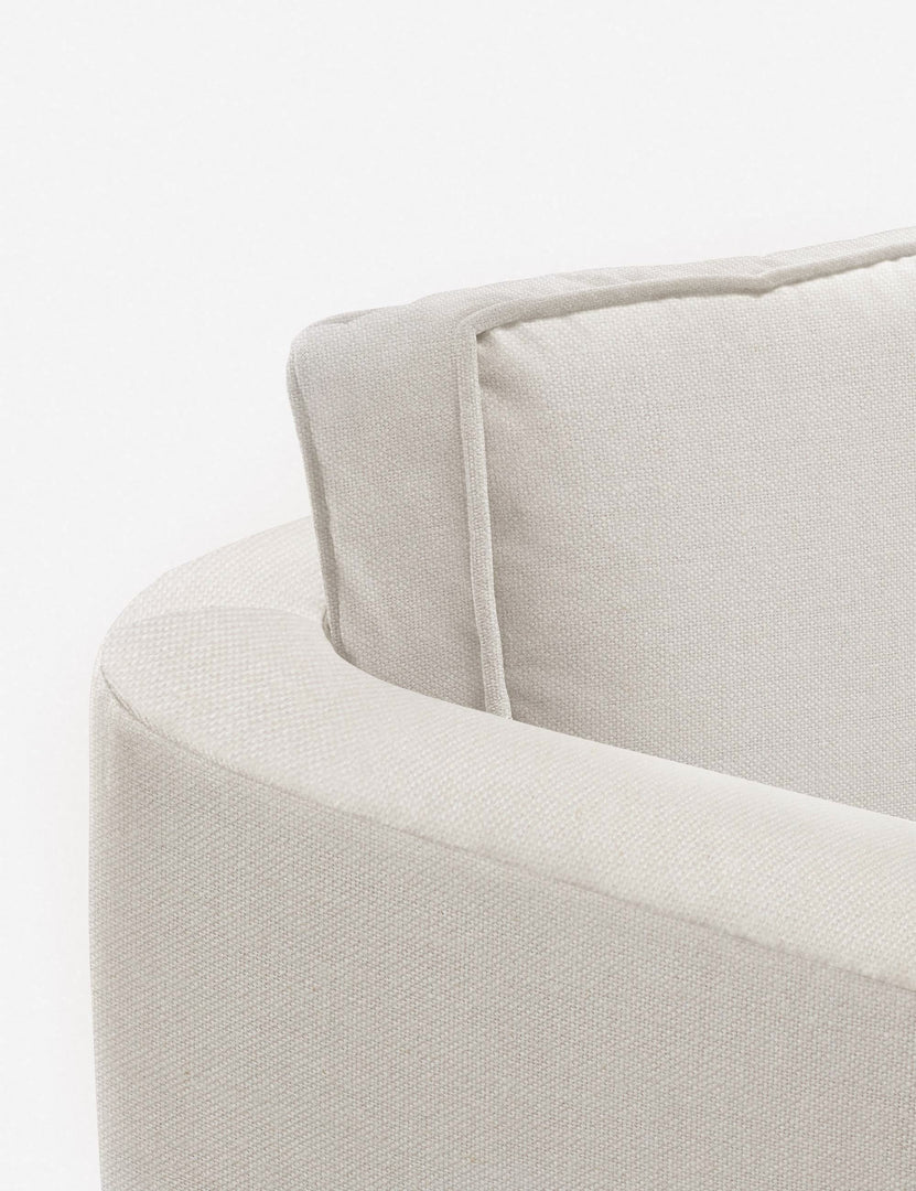 #color::natural | Close-up of the curved back on the Belmont Natural linen accent chair