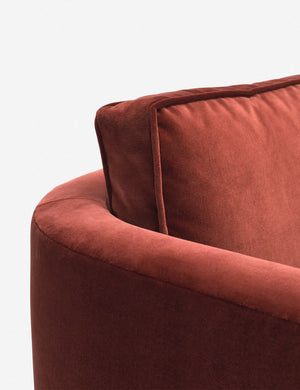 Close-up of the curved back on the Belmont Paprika red velvet accent chair