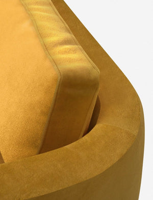 The curved back on the Belmont Goldenrod Velvet left-facing sectional sofa