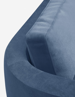 The curved back on the Belmont Harbor Blue Velvet left-facing sectional sofa
