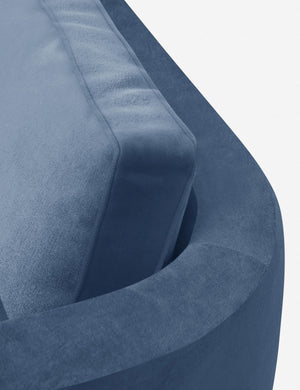 The curved back on the Belmont Harbor Blue Velvet right-facing sectional sofa