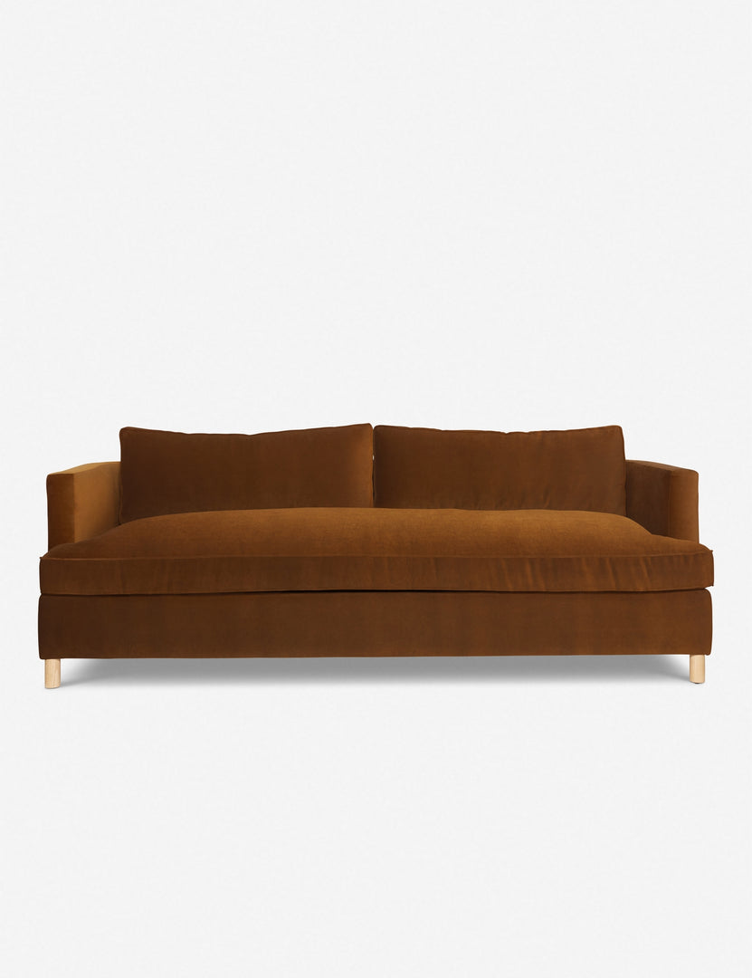 Three-seater sofa in muted green fabric with two back cushions and wooden legs, modern sofa design.