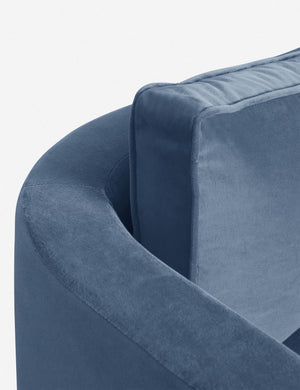 The curved back and arm of the Harbor Blue Velvet Belmont Sofa