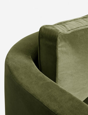 The curved back and arm of the Jade Green Velvet Belmont Sofa