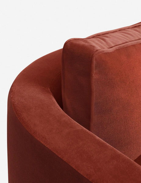 #size::72-W #size:84-W #color::paprika #size::96-W | The curved back and arm of the Paprika Velvet Belmont Sofa