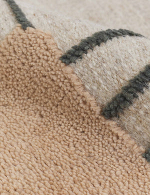 Detailed shot of the hand-knotted wool fabric on the Benita natural toned hand-knotted floor rug by Nina Freudenberger