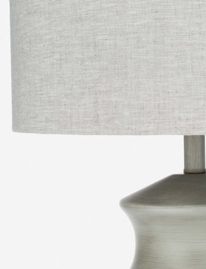 Close-up of the natural linen material on the finial of the Bhavanah Table Lamp with a gray spindle designed base