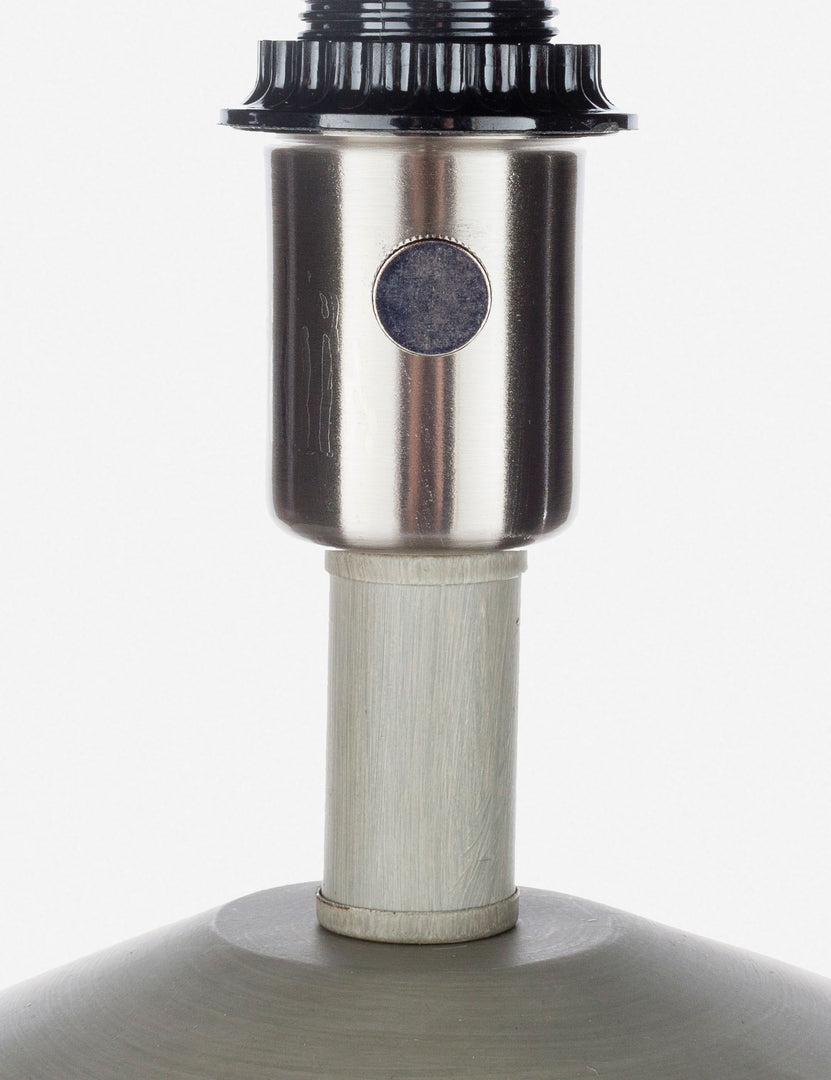 | Close-up of the light bulb insert on the Bhavanah Table Lamp with a gray spindle designed base