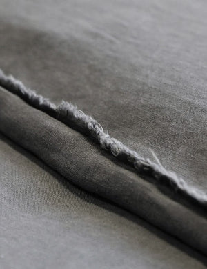 Close-up of the dark gray blair stonewashed linen duvet by pom pom at home