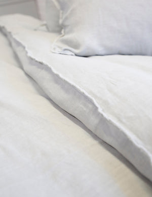 Close-up of the light gray blair stonewashed linen duvet by pom pom at home