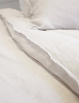 Close-up of the taupe blair stonewashed linen duvet by pom pom at home