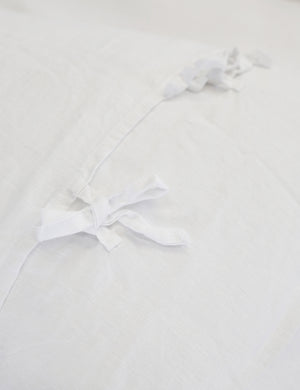 Close-up of the ties on the back of the white blair stonewashed linen duvet by pom pom at home