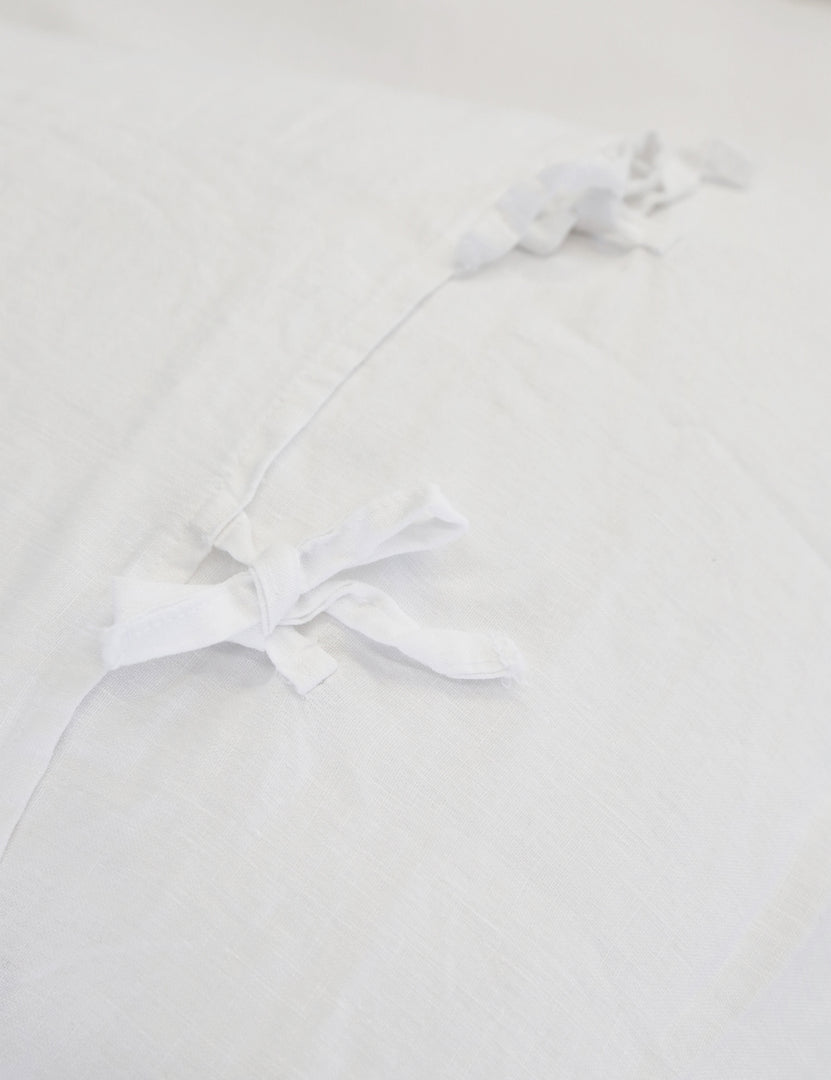 #color::white #size::king #size::queen | Close-up of the ties on the back of the white blair stonewashed linen duvet by pom pom at home