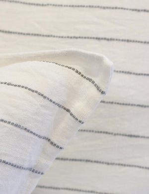 Close-up of the Blake cream and gray linen duvet by pom pom at Home