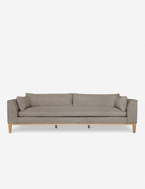 Charleston Flannel Linen sofa with a single seat cushion, natural oak base, and gently curved arms