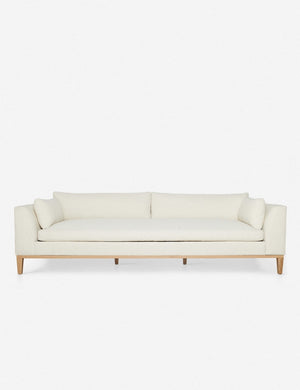 Charleston Ivory Linen sofa with a single seat cushion, natural oak base, and gently curved arms