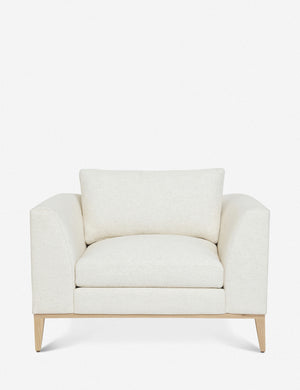 Charleston ivory linen upholstered accent chair with a natural oak base and a deep plush seat