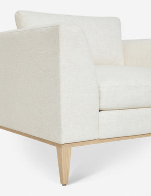Close-up of the corner of the base of the Charleston ivory linen accent chair