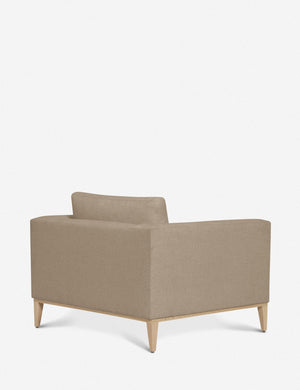 Angled rear-view of the Charleston Pebble gray linen accent chair