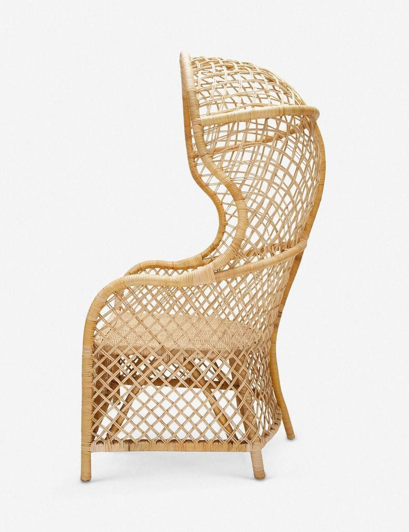 | Side view of the Charley rattan accent chair with sloping back