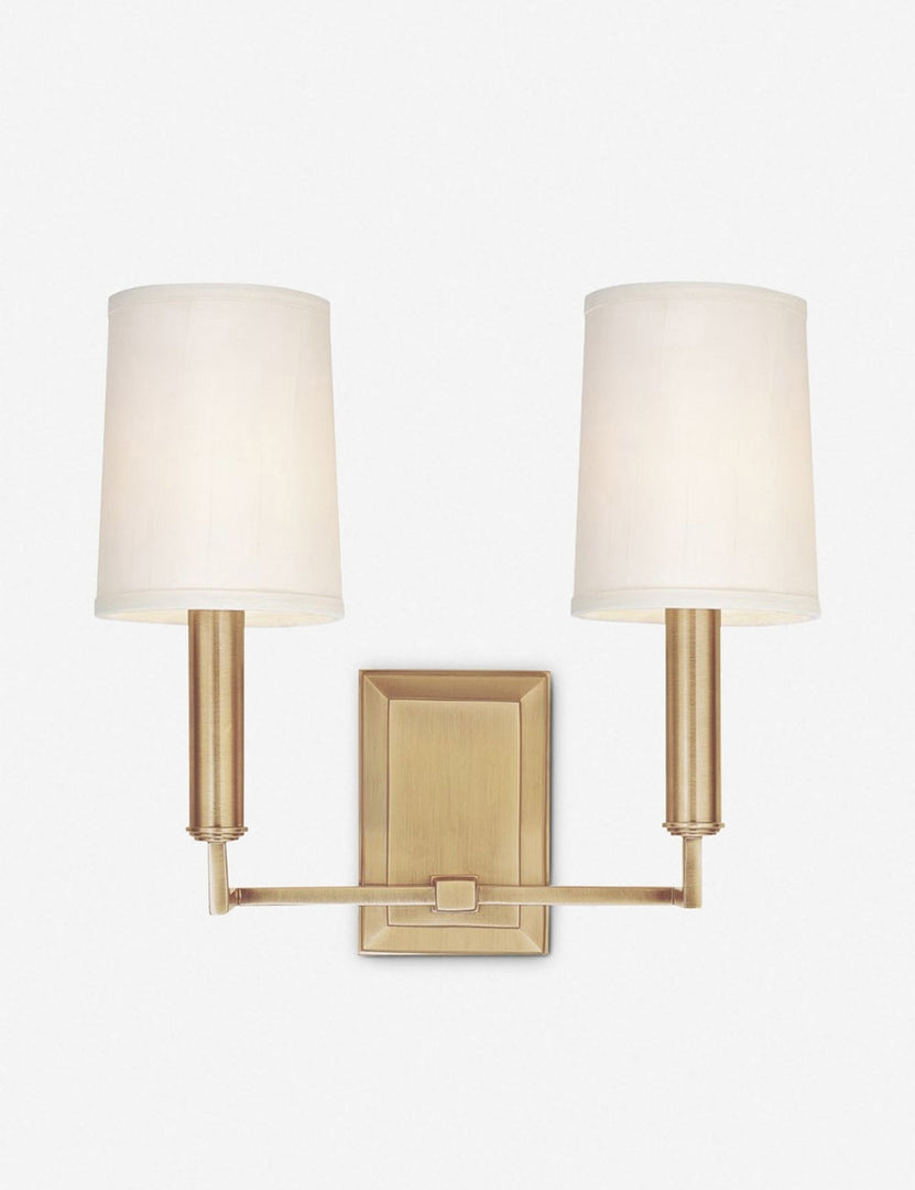 #color::brass | Charlie brass double sconce with parchment shades and angular arms