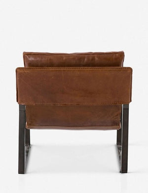 Rear view of brown leather Marlyne sling-back accent chair with black metal frame