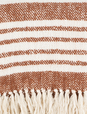 Close-up of the edge of the Elulia woven two-tone cognac throw with fringed ends