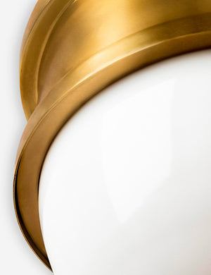Close-up of the gold hardware around the Cristof oval golden Pendant Light