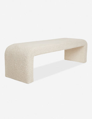 Angled view of Tate cream boucle upholstered bench.