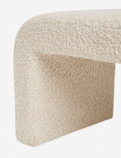 #color::cream | Close-up of the boucle texture on the inner leg and side of the Tate cream upholstered bench. 