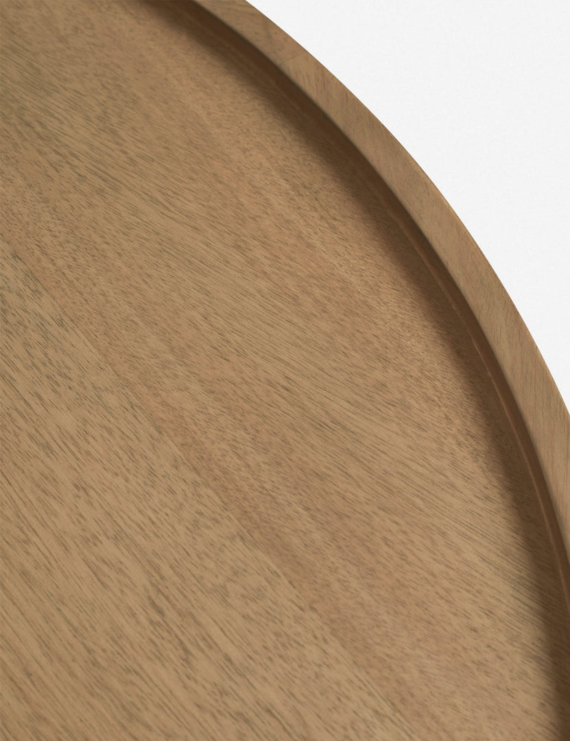 | Close-up of the top of the Delta ash wood round coffee table with three column legs