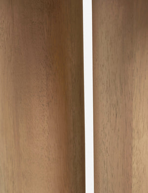 Close-up of the pedestal base on the Delta natural wooden side table
