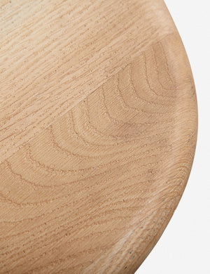 Close-up of the oak wood texture on the Mela oak wood dining table.