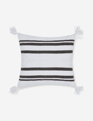 Fez indoor and outdoor white throw pillow with weather-resistant fabric, black stripes, and fringe on all four corners