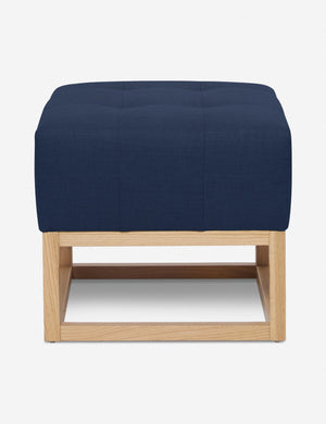 Dark Blue Linen Grasmere Ottoman with an upholstered cushion and airy wooden frame by Ginny Macdonald
