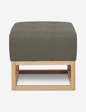 Loden Gray Linen Grasmere Ottoman with an upholstered cushion and airy wooden frame by Ginny Macdonald
