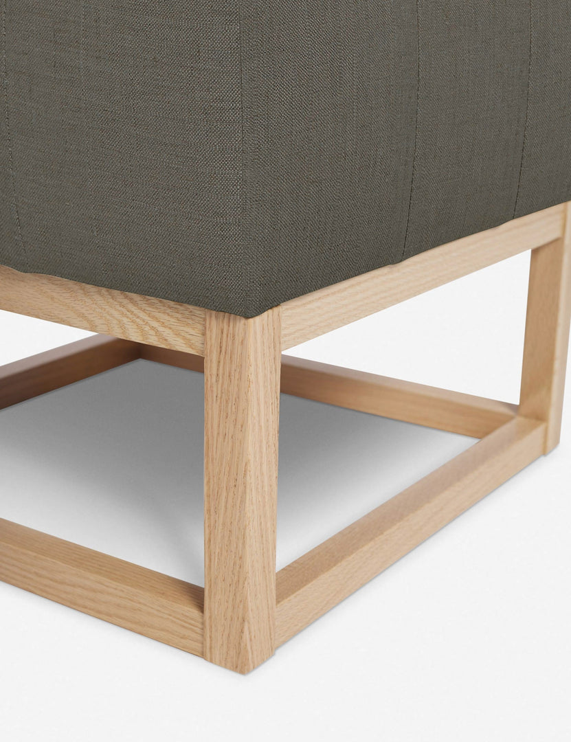 #color::loden | Close up of the airy wooden frame on the bottom of the Grasmere Loden Gray Linen Ottoman