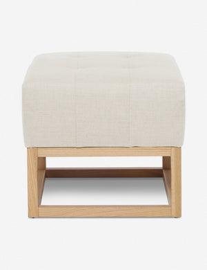 Natural Linen Grasmere Ottoman with an upholstered cushion and airy wooden frame by Ginny Macdonald