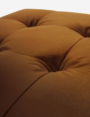 Button tufting on the cushion of the Cognac Velvet Grasmere Ottoman