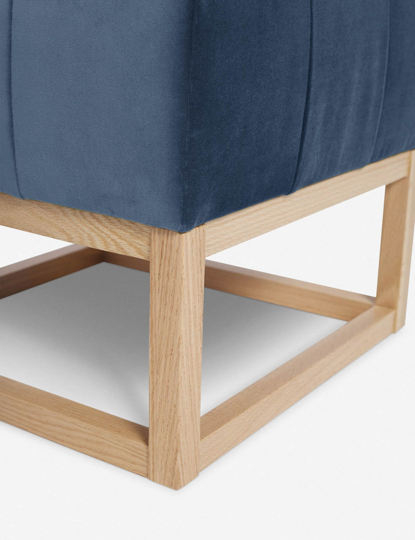 #color::harbor | Close up of the airy wooden frame on the bottom of the Grasmere Harbor Blue Velvet Ottoman